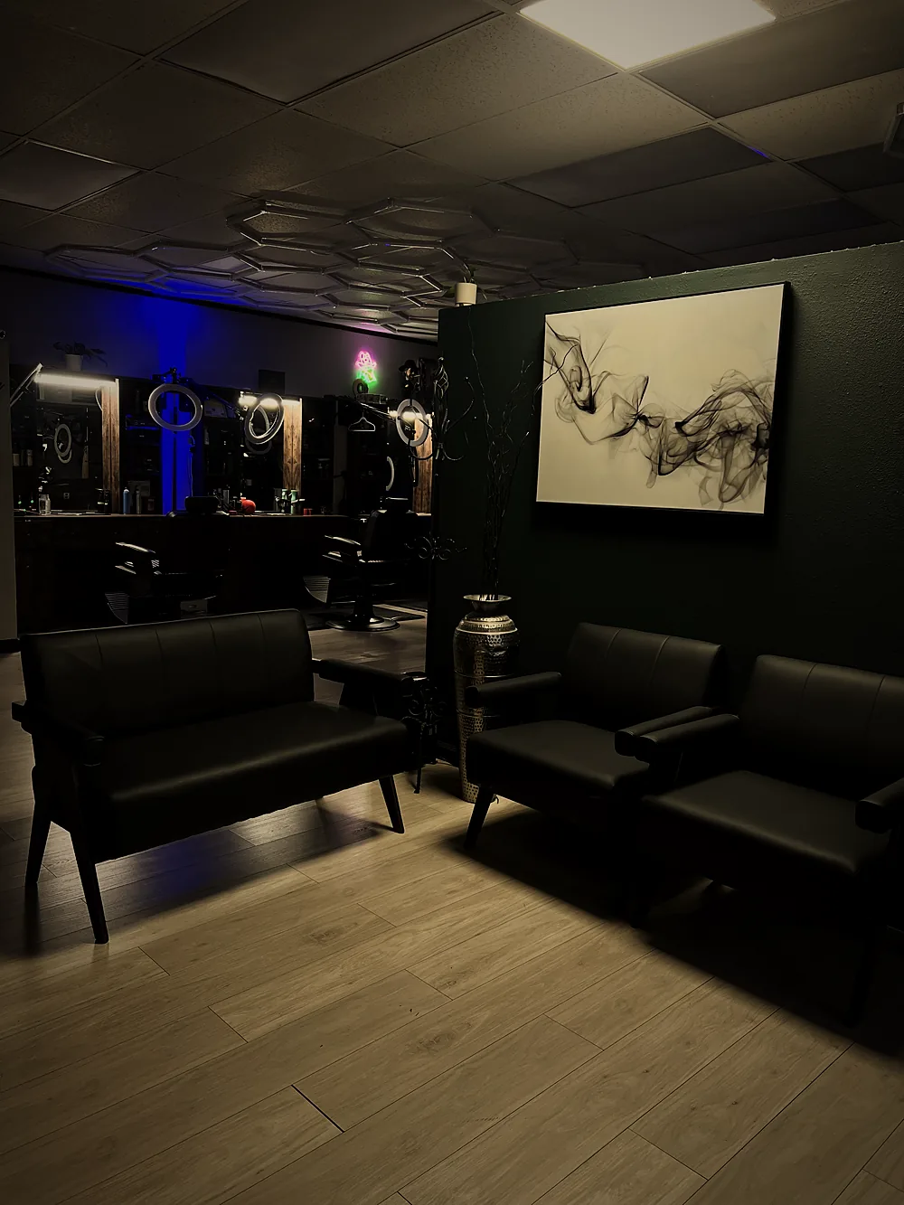 Waiting lounge with leather seating at Modesto Barber Co.